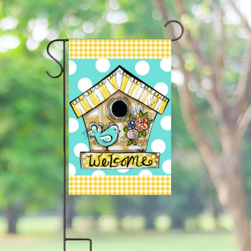 Blue Bird Spring Garden Flag displayed in a yard, adding vibrant color to outdoor decor.