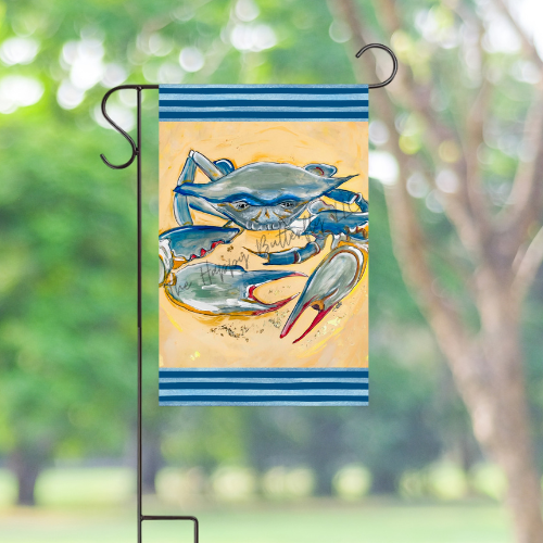 Golden Yellow Crab Garden Flag displayed outdoors in a coastal setting